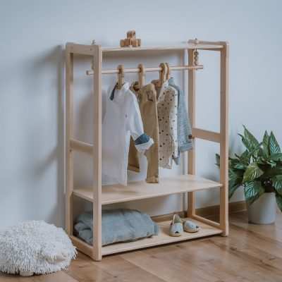 Montessori-inspired wooden wardrobe with shelf and two maxi shelves for children, promoting independence and self-confidence.