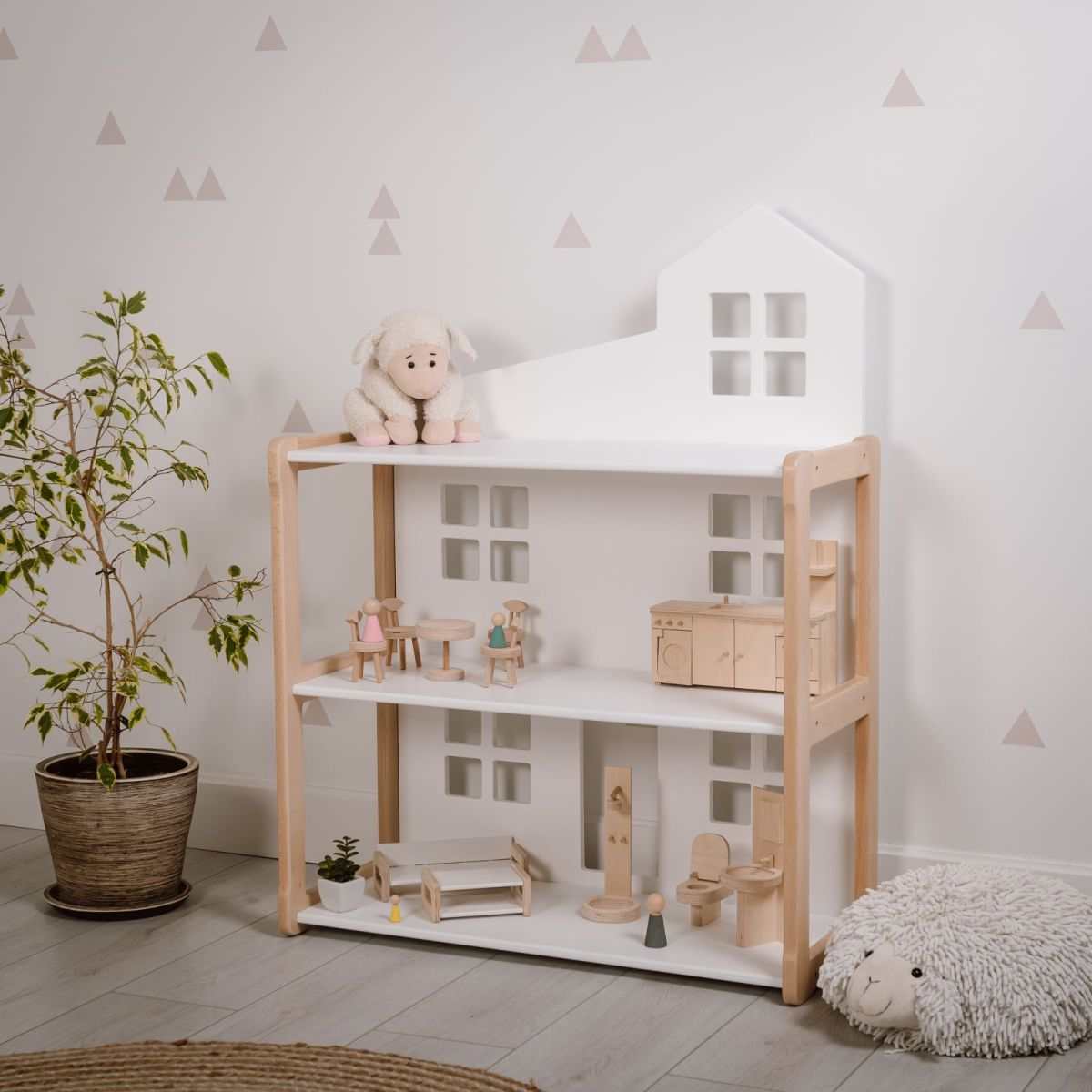 Puppenhausregal NOBI - Montessori® wooden dollhouse shelf in a room, no furniture or dolls included.