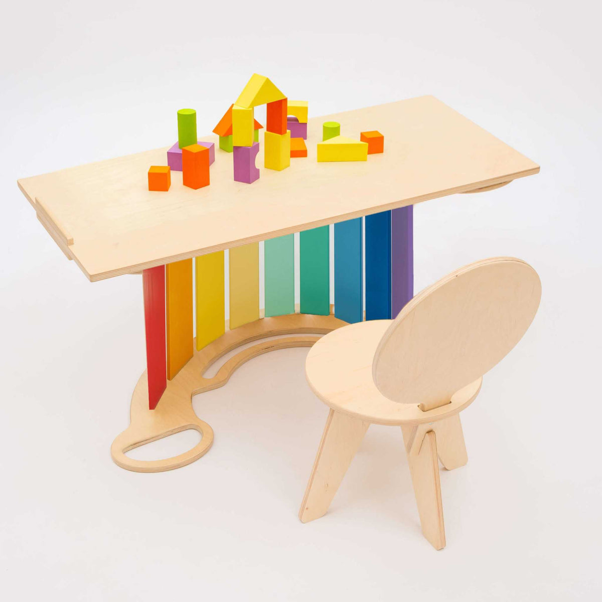 Kids wooden set with rocker, reversible board, mini chair, and colorful blocks.