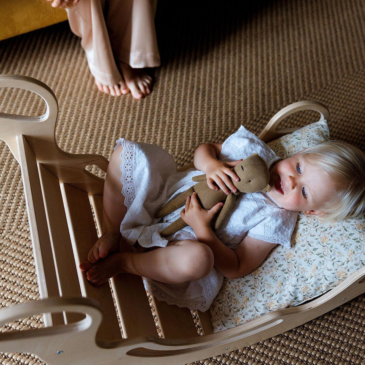 Montessori wood rocker with birch plywood board, promoting motor skills in children.
