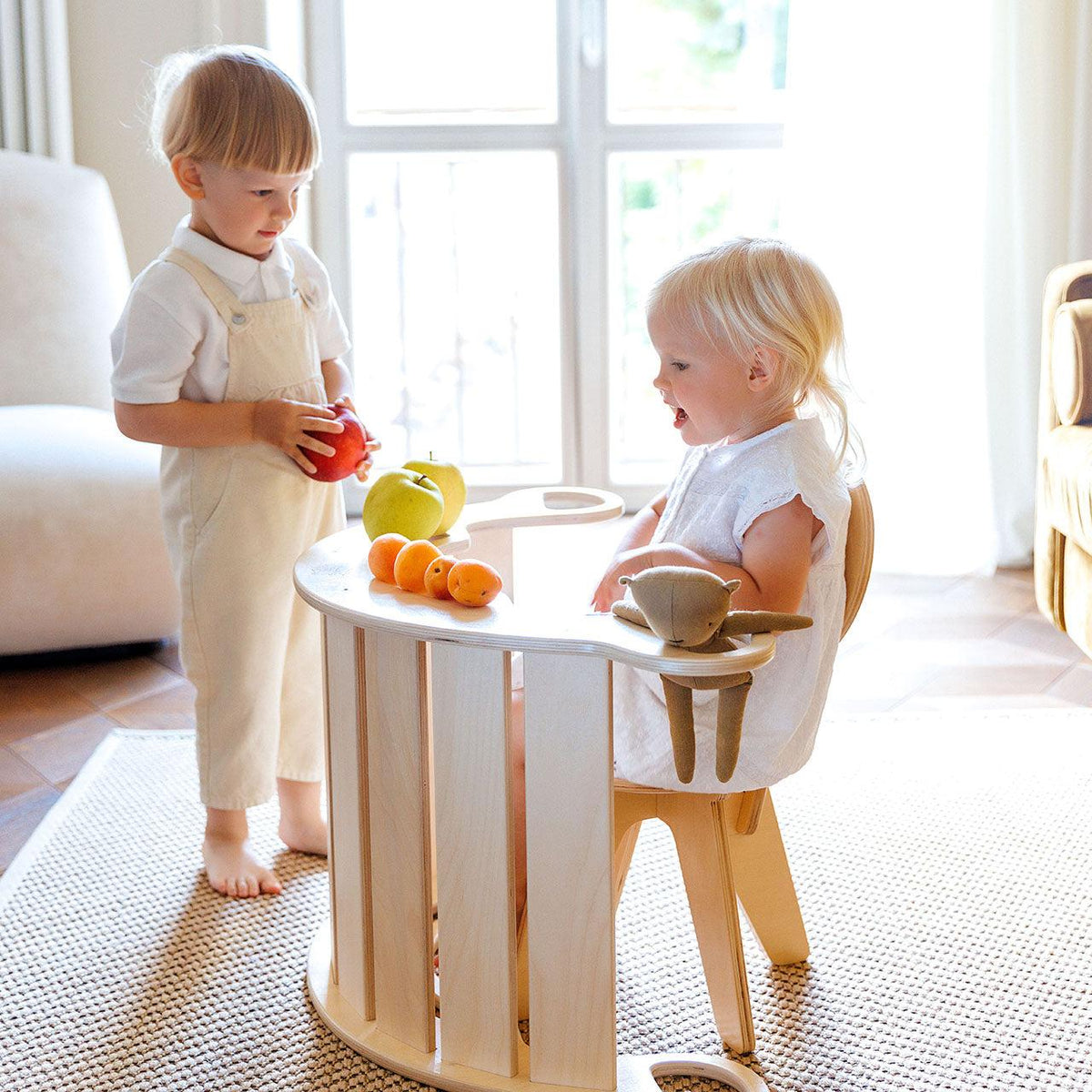 Wooden balance rocker for kids enhancing movement and creativity indoors.
