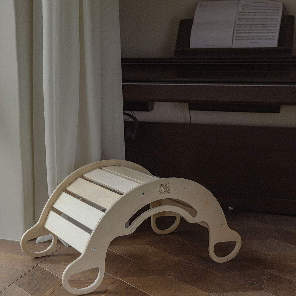 Natural wooden rocker for kids, versatile swing and climbing frame, multi-purpose indoor play equipment.