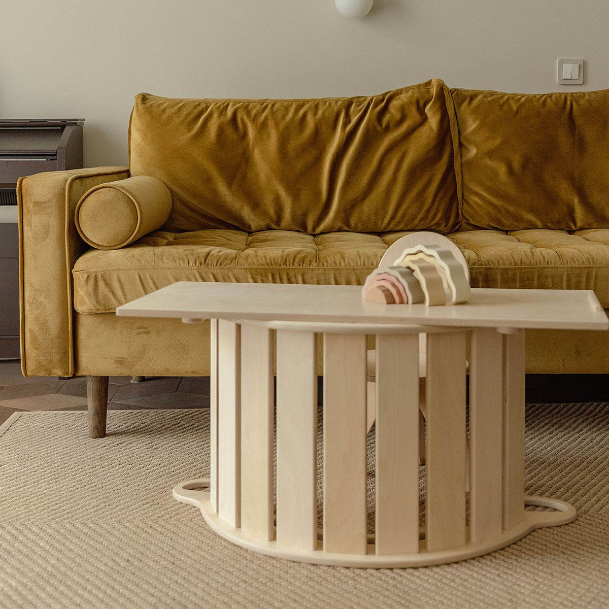 Wooden balance rocker with double-sided board in natural finish, promoting motor skills for kids.