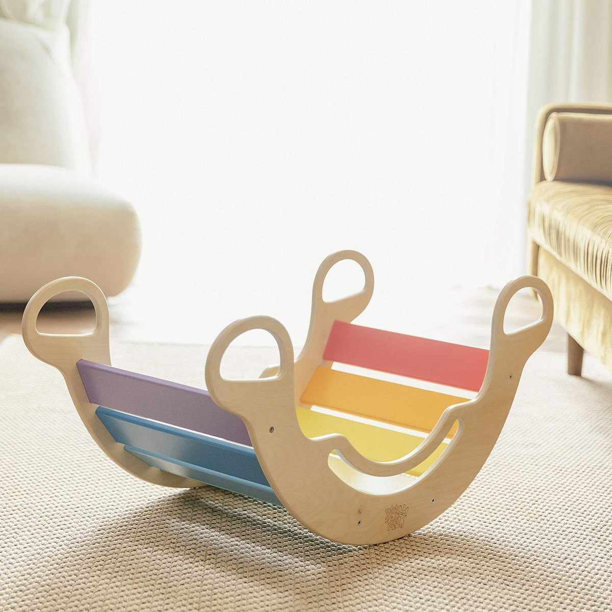 Children&#39;s wooden balance rocker in pastel colors, versatile for play and seating, available as a set with a mini chair.