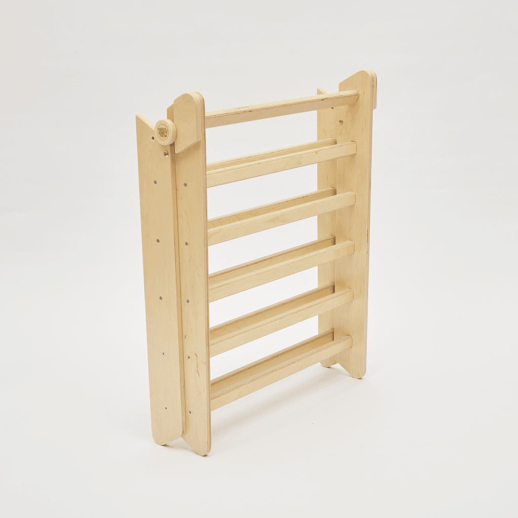 Natural wooden climbing frame with slide and ladder, certified safe for children.