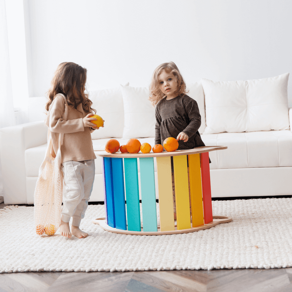 Eco-friendly wooden balance rocker in bright colors, suitable for children from 1 year, with multiple functionalities including swing and climbing frame.