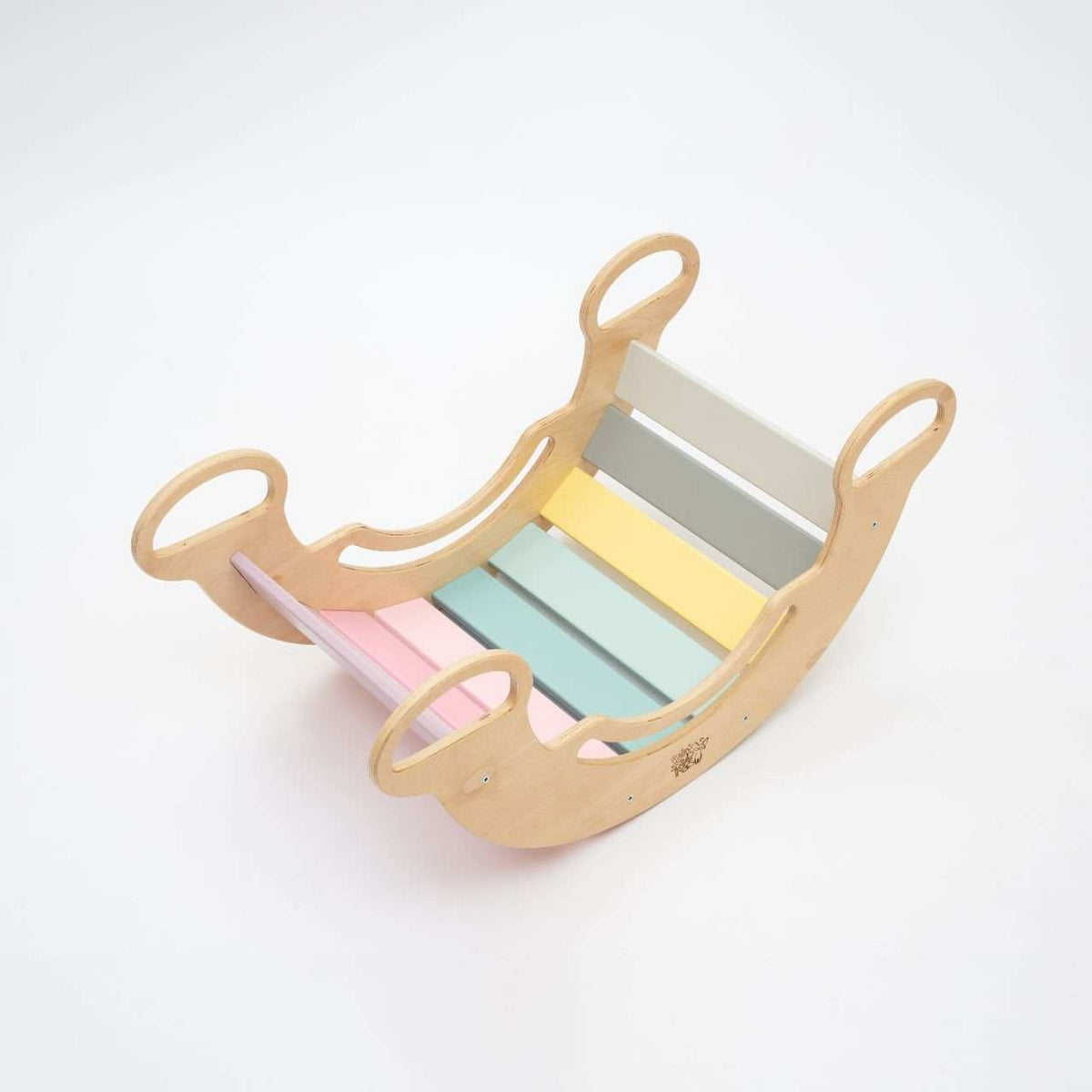 Pastel-colored rocker set with double-sided board and mini chair for children.