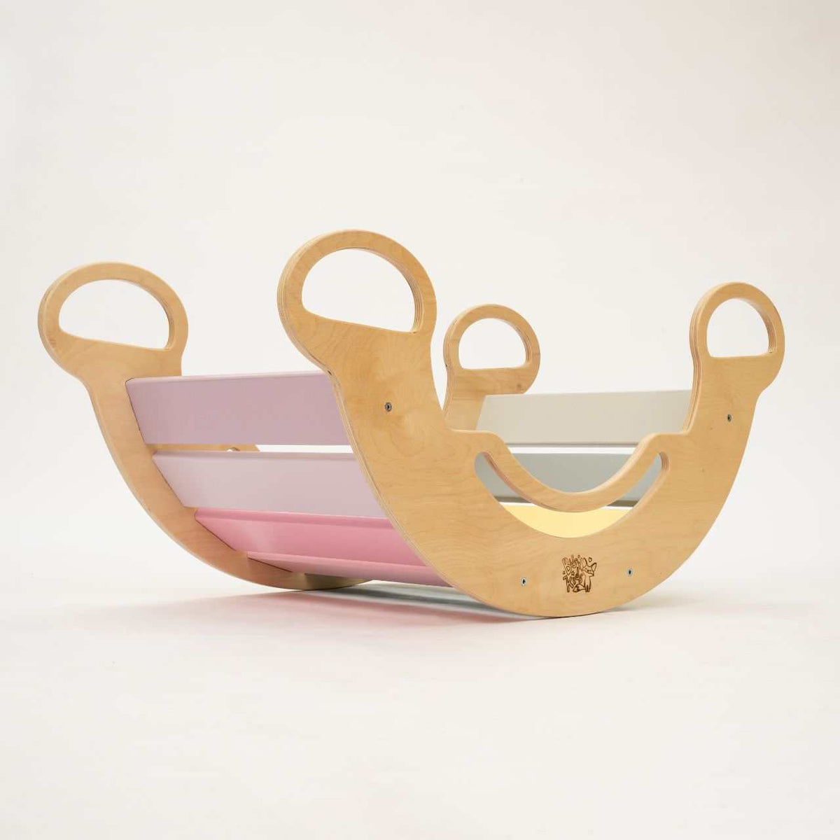 Set of rocking toy and double-sided board in pastel colors, perfect for children&#39;s play.