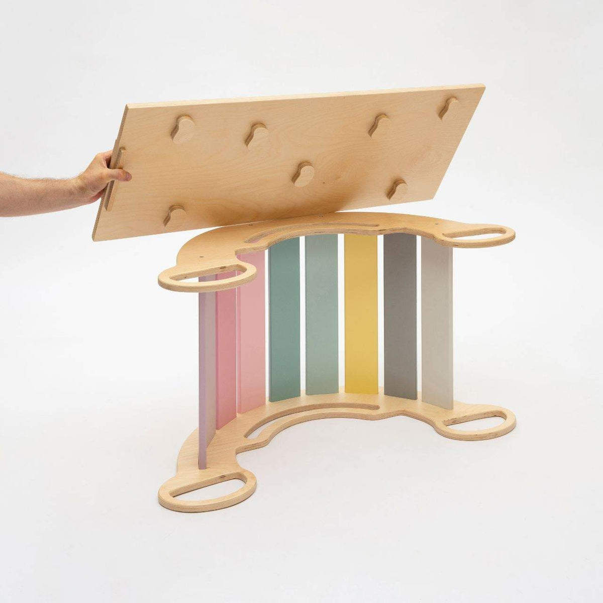 Montessori 5-in-1 pastel balance rocker with reversible birchwood board for motor skill development.