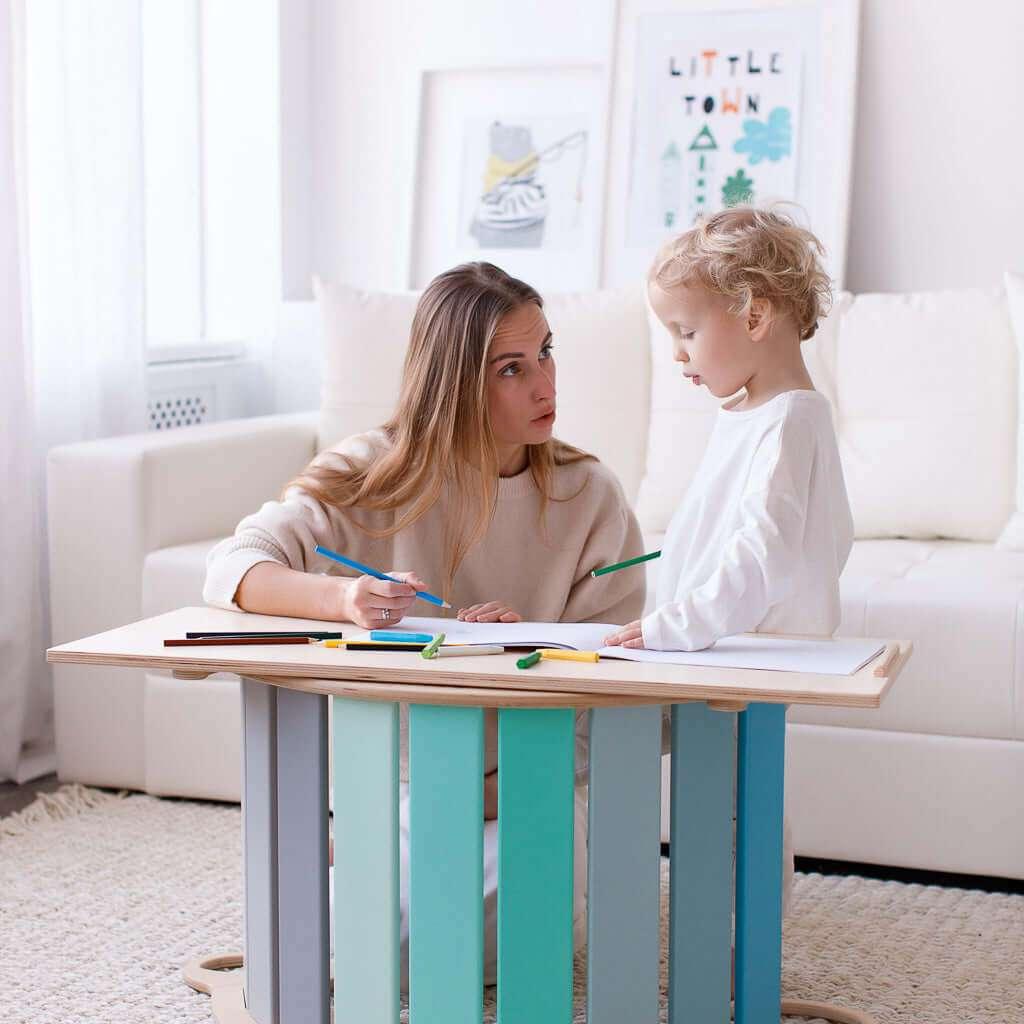 Montessori 5-in-1 wooden rocker with double-sided board in mint, promoting motor skills development.