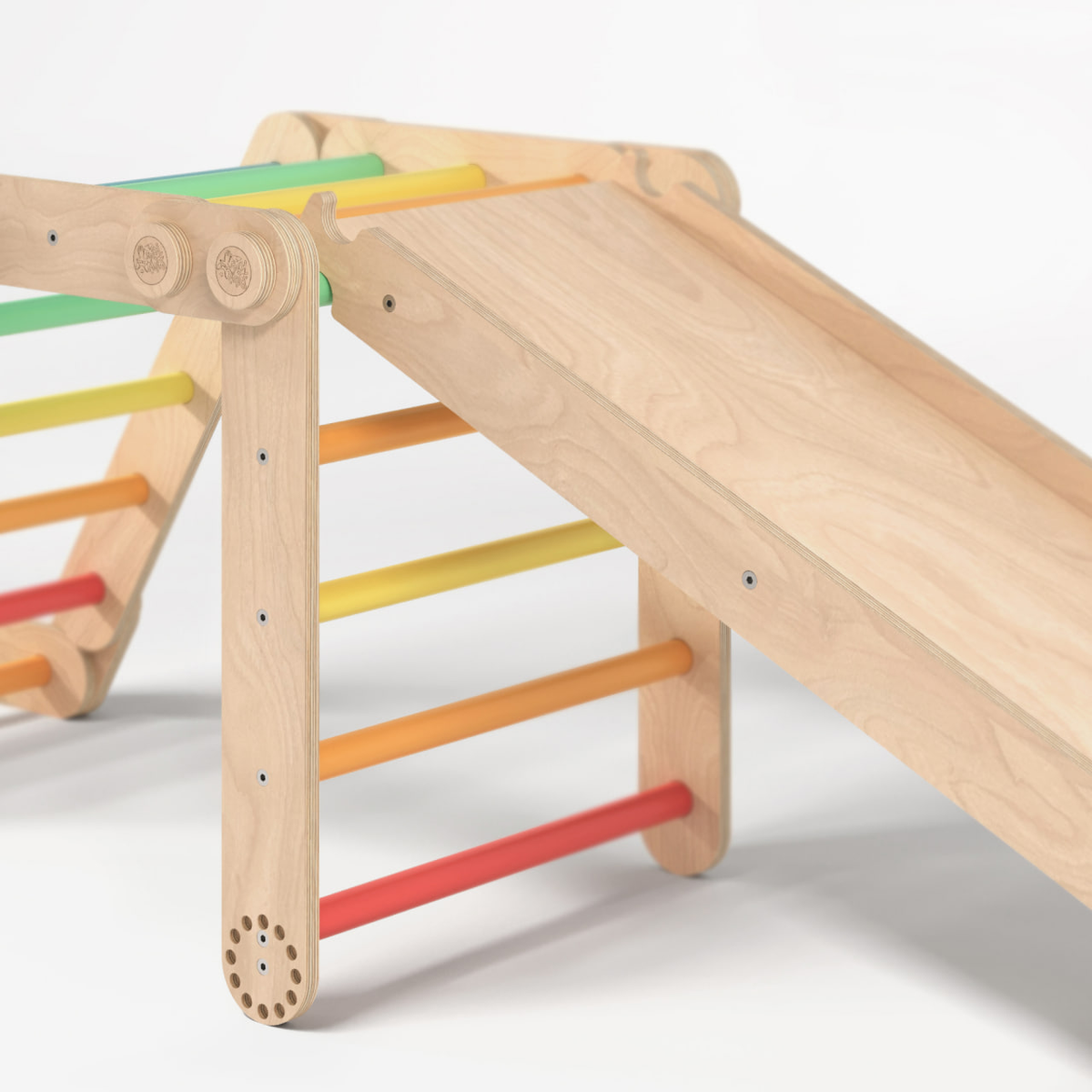 Children&#39;s climbing set with slide in rainbow colors and eco-friendly birch wood.
