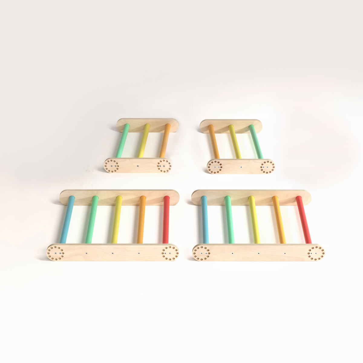 Children&#39;s wooden climbing set with colorful rungs, including two large and two small Pikler triangles.