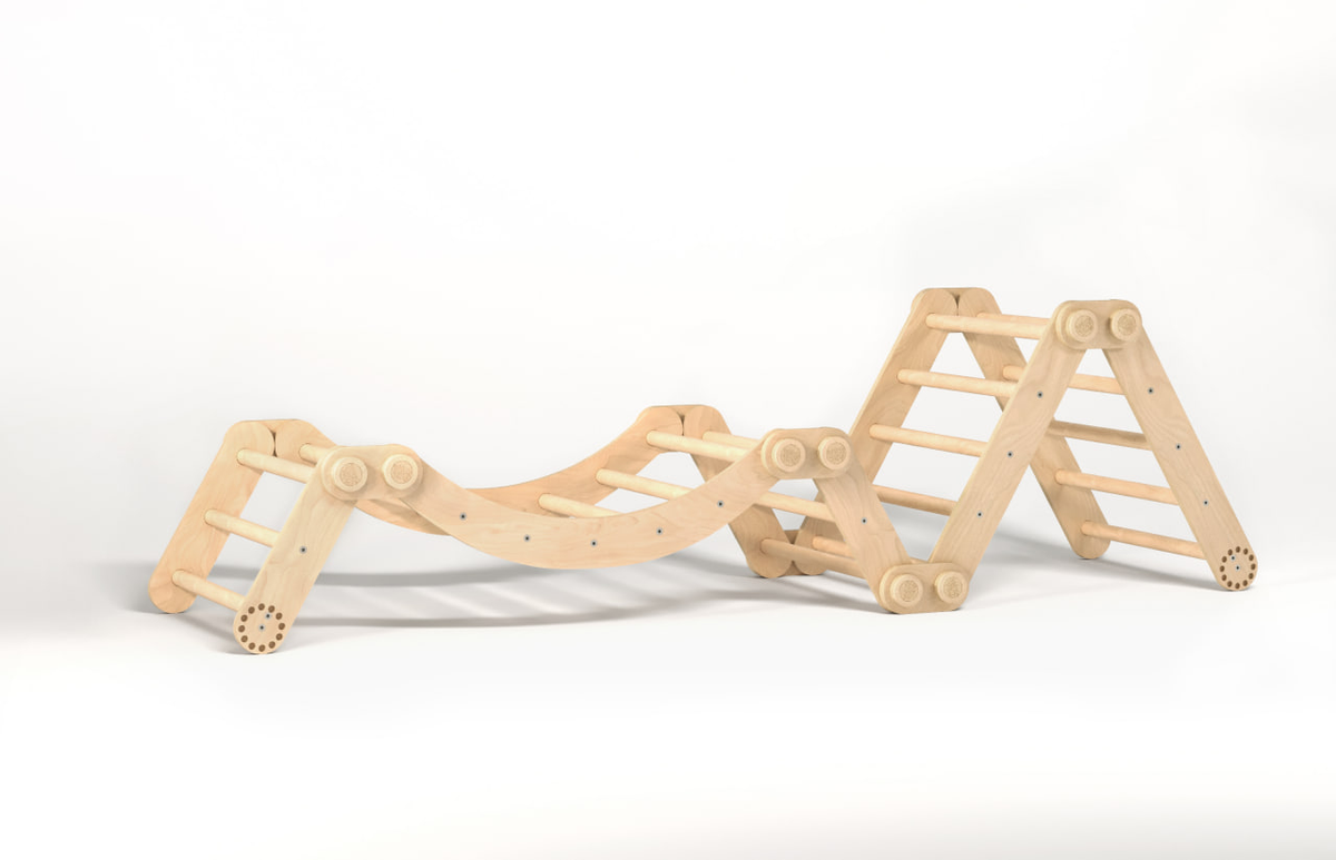 Children&#39;s natural wooden climbing frame set with swing, featuring modular Pikler triangles.