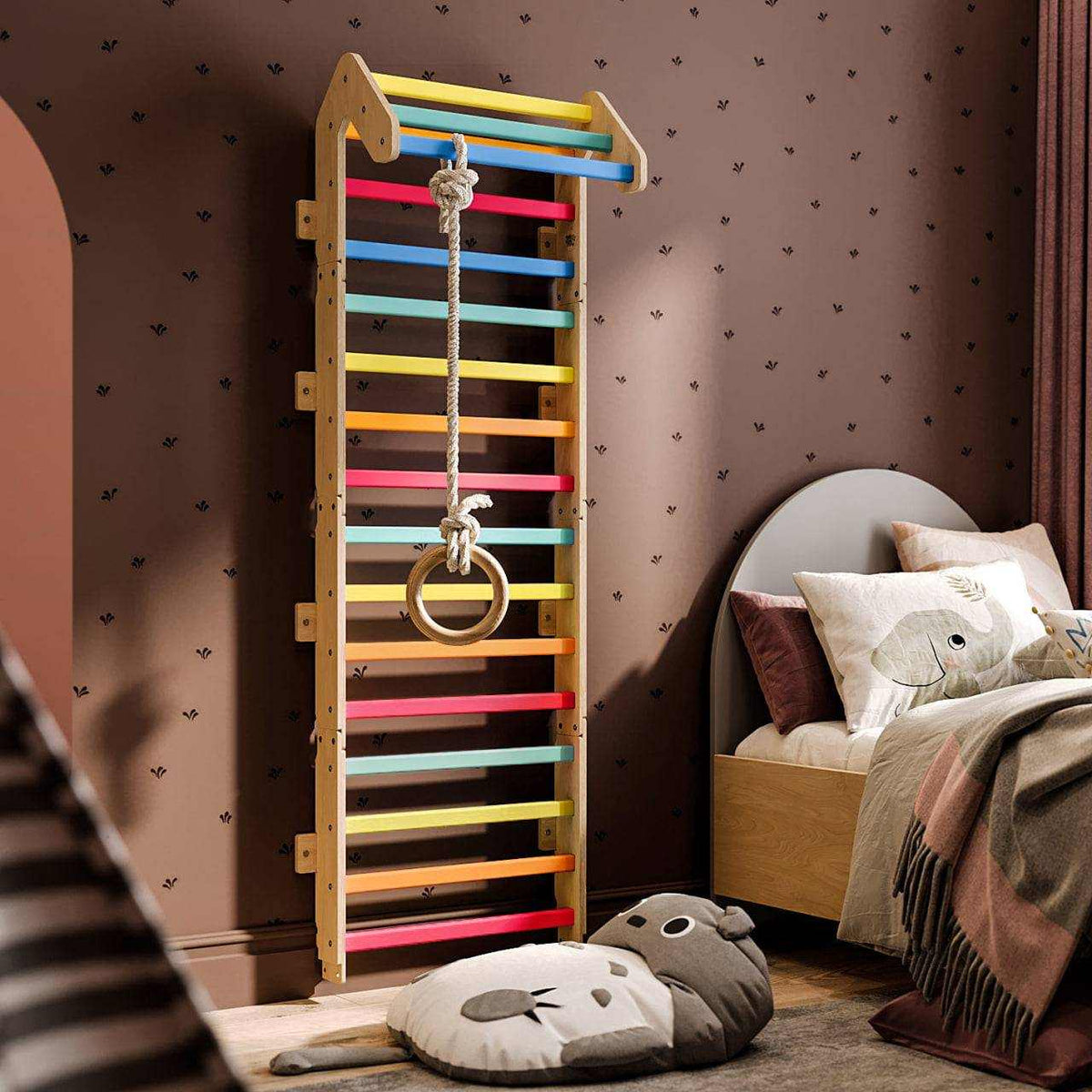Indoor children&#39;s climbing wall with colorful rungs, featuring a pull-up bar and gymnastic rings.