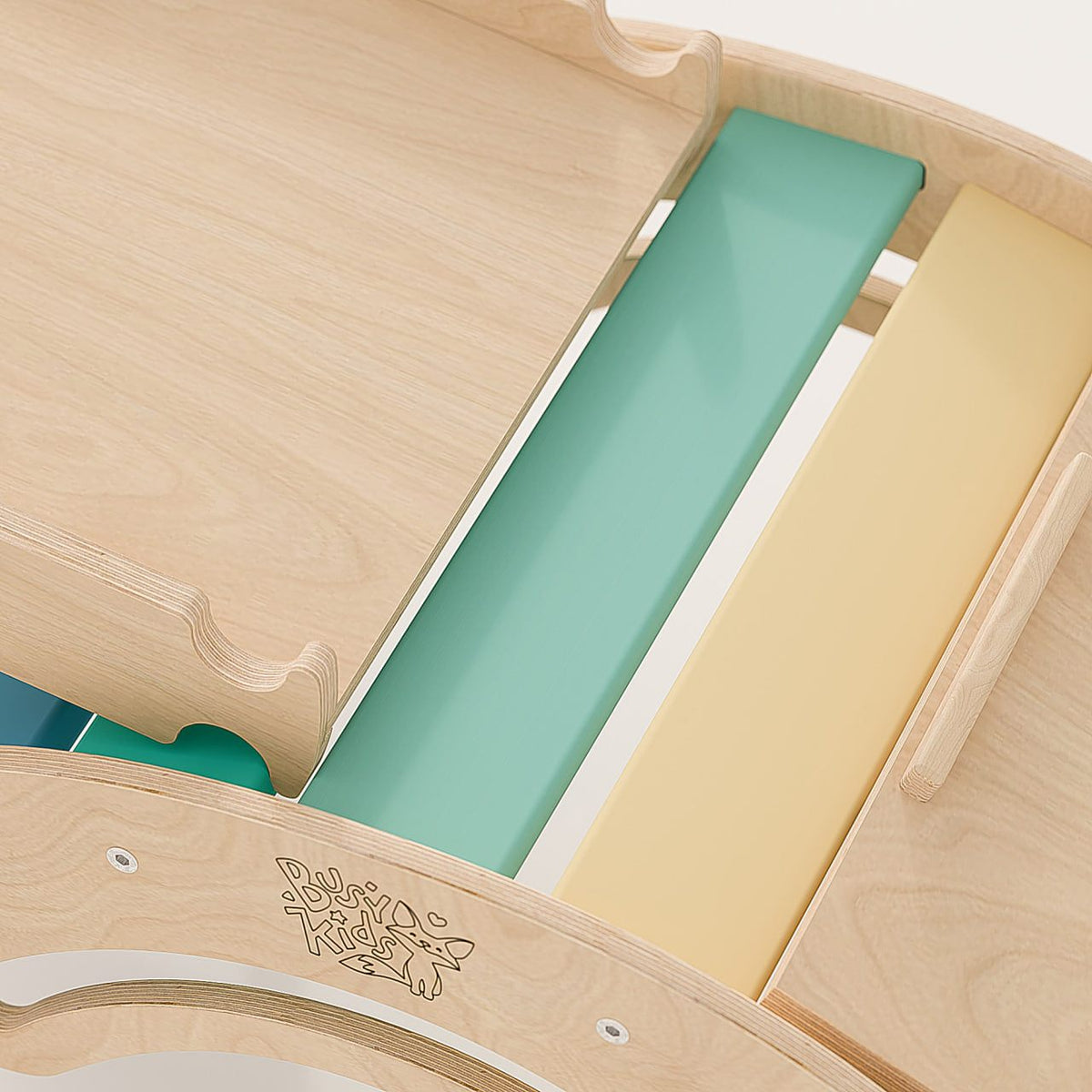 Wooden climbing set with rainbow-colored bars featuring a Pikler triangle, balance rocker, and slides.